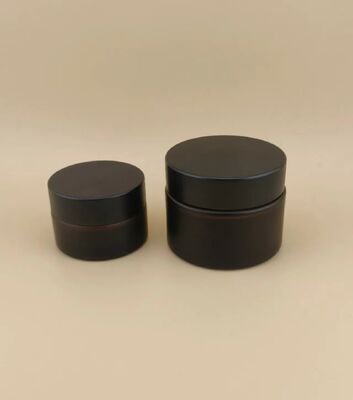 طراحي خوب شیشه هاي سياه قوطي خامه اي با سرپوش پیچ دار براي لوشن