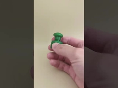 کلاه سبز پلاستیکی صاف با دکمه برای بطری های آرایشی