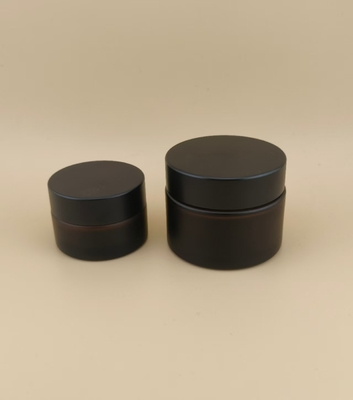 طراحي خوب شیشه هاي سياه قوطي خامه اي با سرپوش پیچ دار براي لوشن