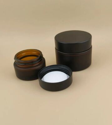 طراحي خوب شیشه هاي سياه قوطي خامه اي با سرپوش پیچ دار براي لوشن