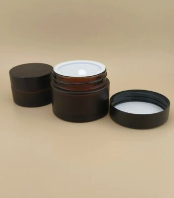 طراحي خوب شیشه هاي سياه قوطي خامه اي با سرپوش پیچ دار براي لوشن